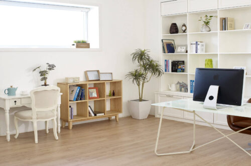 Modern office with build in bookshelves and desks