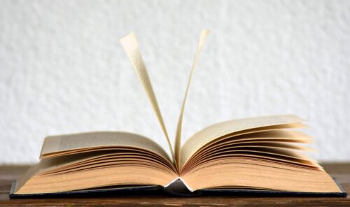 Open book resting on table