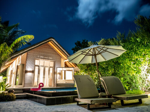 A night shot of a luxury beach villa