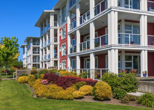 Modern apartment buildings with large porches and nice landscaping