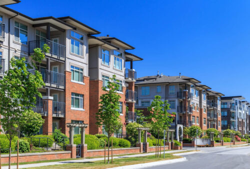 Modern apartment buildings with icon gate entranceways