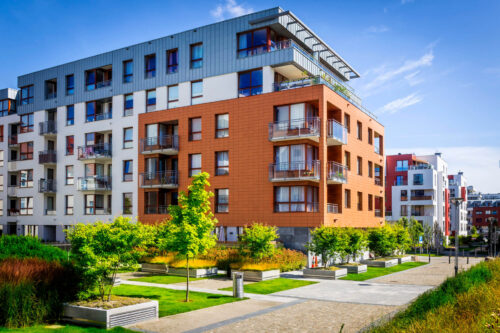 Walkway leading along the new colorful cmplex of apartment buildings